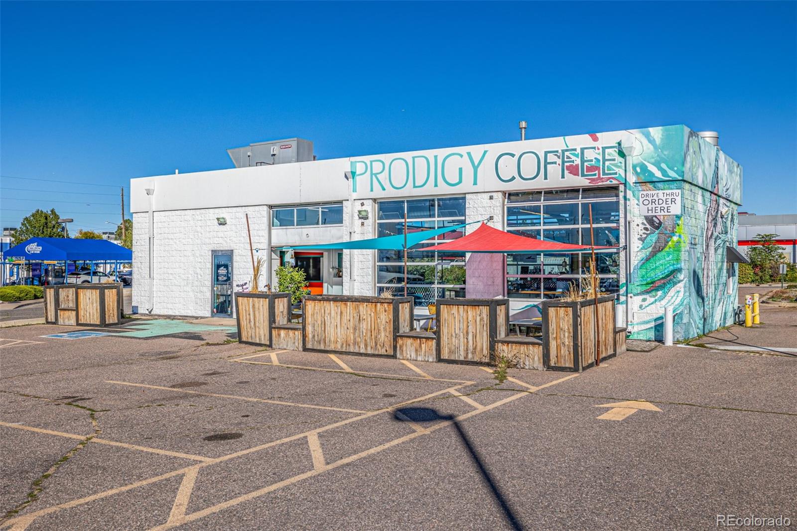 3854 Cook Street Denver, CO 80205 - Photo 37 of 42 a view of a cafe with sitting area