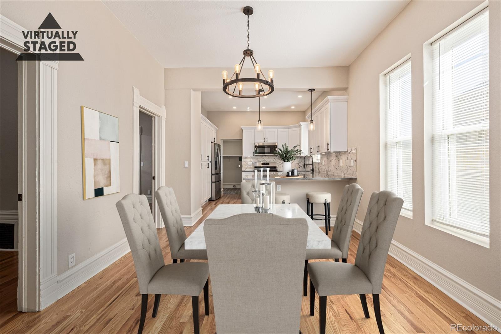 3854 Cook Street Denver, CO 80205 - Photo 9 of 42 a view of a dining room with furniture window and wooden floor