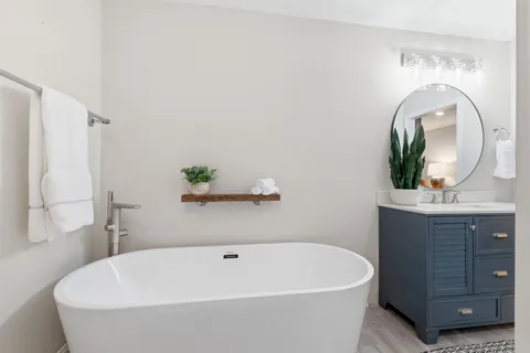 a white bath tub sitting in a bathroom