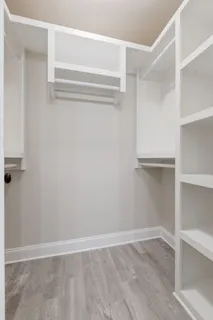 a view of an empty walk in closet