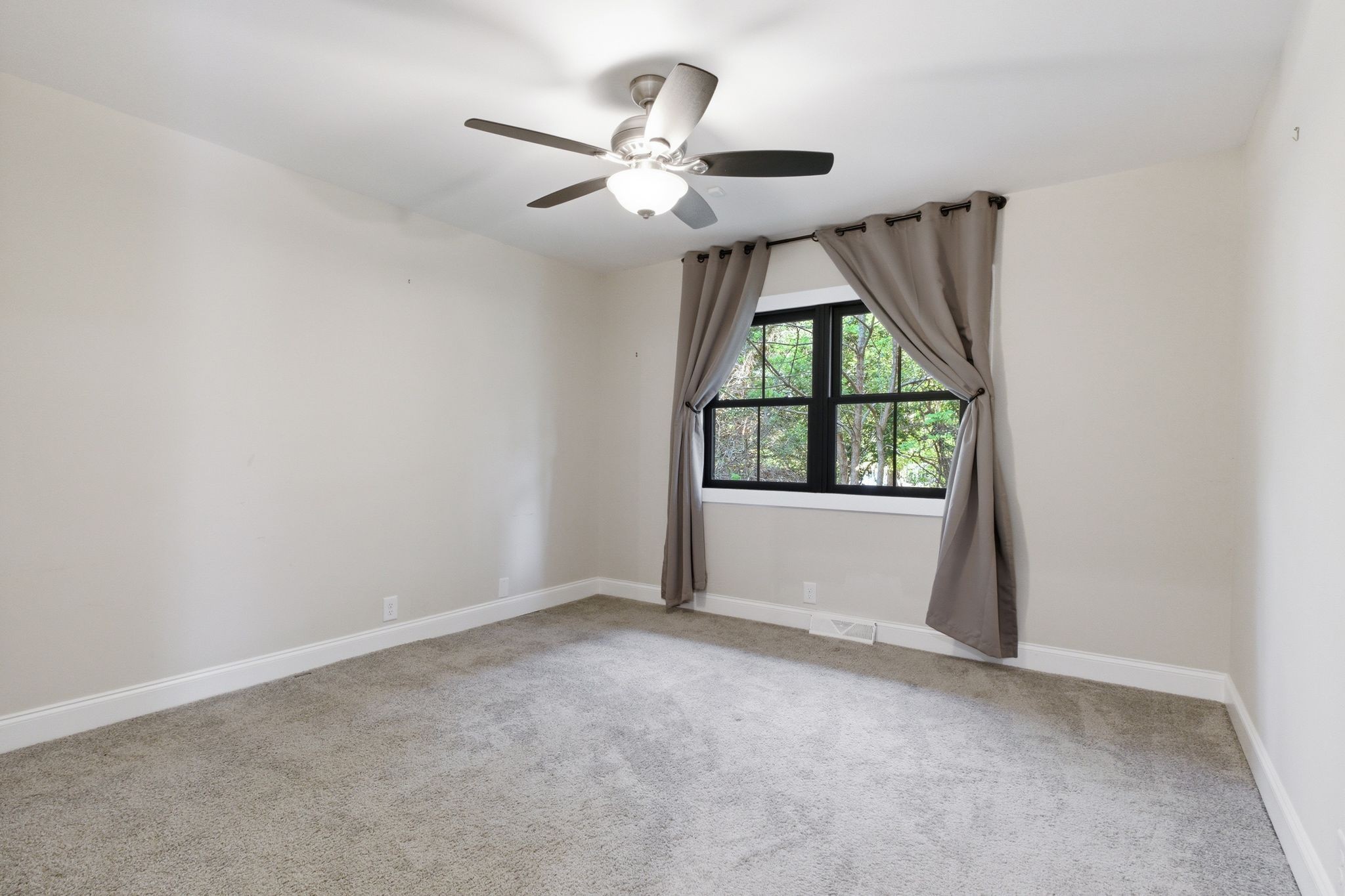 301 Rosebrook Drive Gallatin, TN 37066 - Photo 36 of 49 an empty room with windows and fan