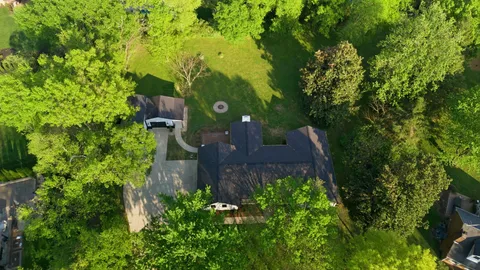 an aerial view of house with yard and outdoor seating