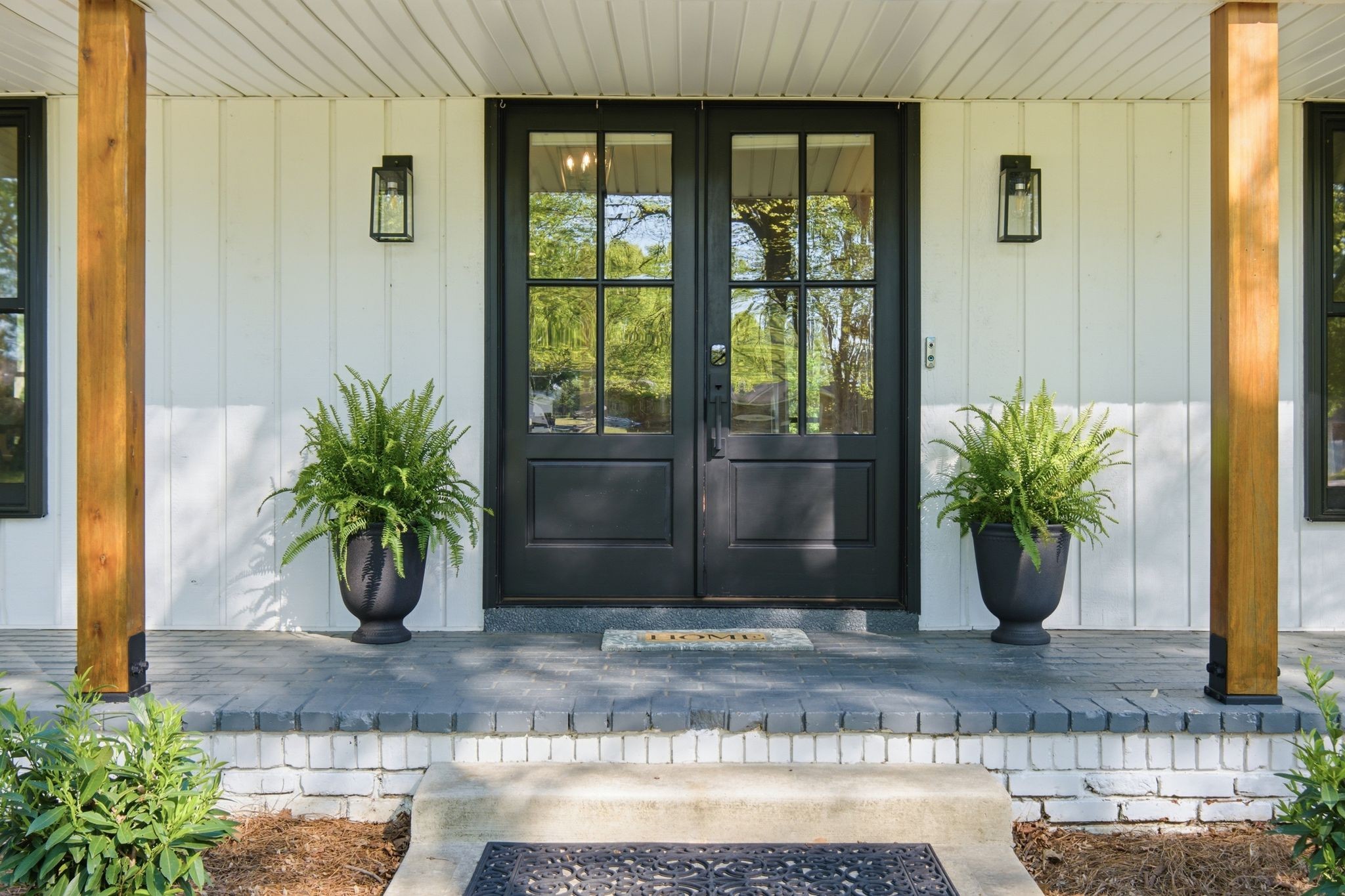 301 Rosebrook Drive Gallatin, TN 37066 - Photo 7 of 49 a view of a potted plant in front of a door