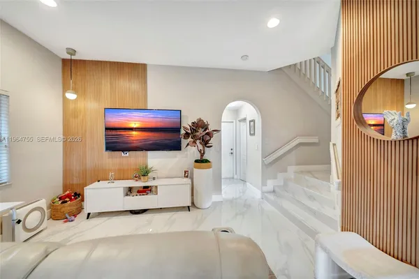 a bedroom with bed and a window