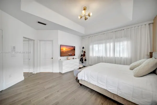 a view of a chair and table in the garden