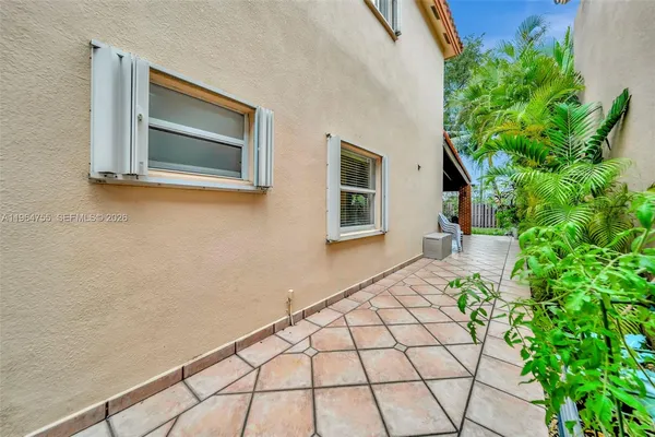 an aerial view of residential houses with outdoor space and river
