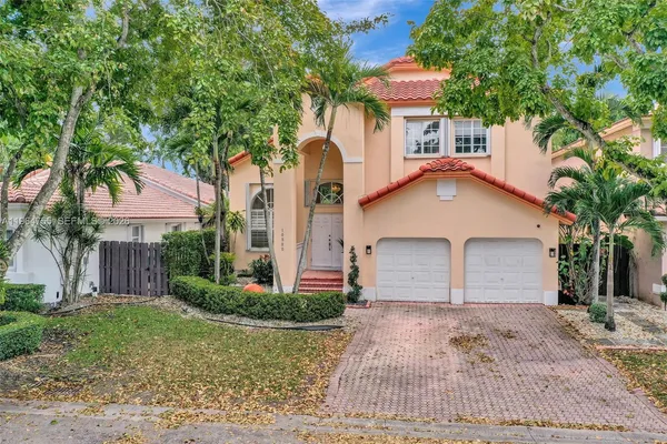 an aerial view of a house with a lake view