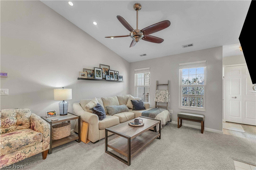28340 Center Ridge Road, Unit 124 Westlake, OH 44145 - Photo 7 of 37 Living room with a ceiling fan, vaulted ceiling, light colored carpet, and recessed lighting