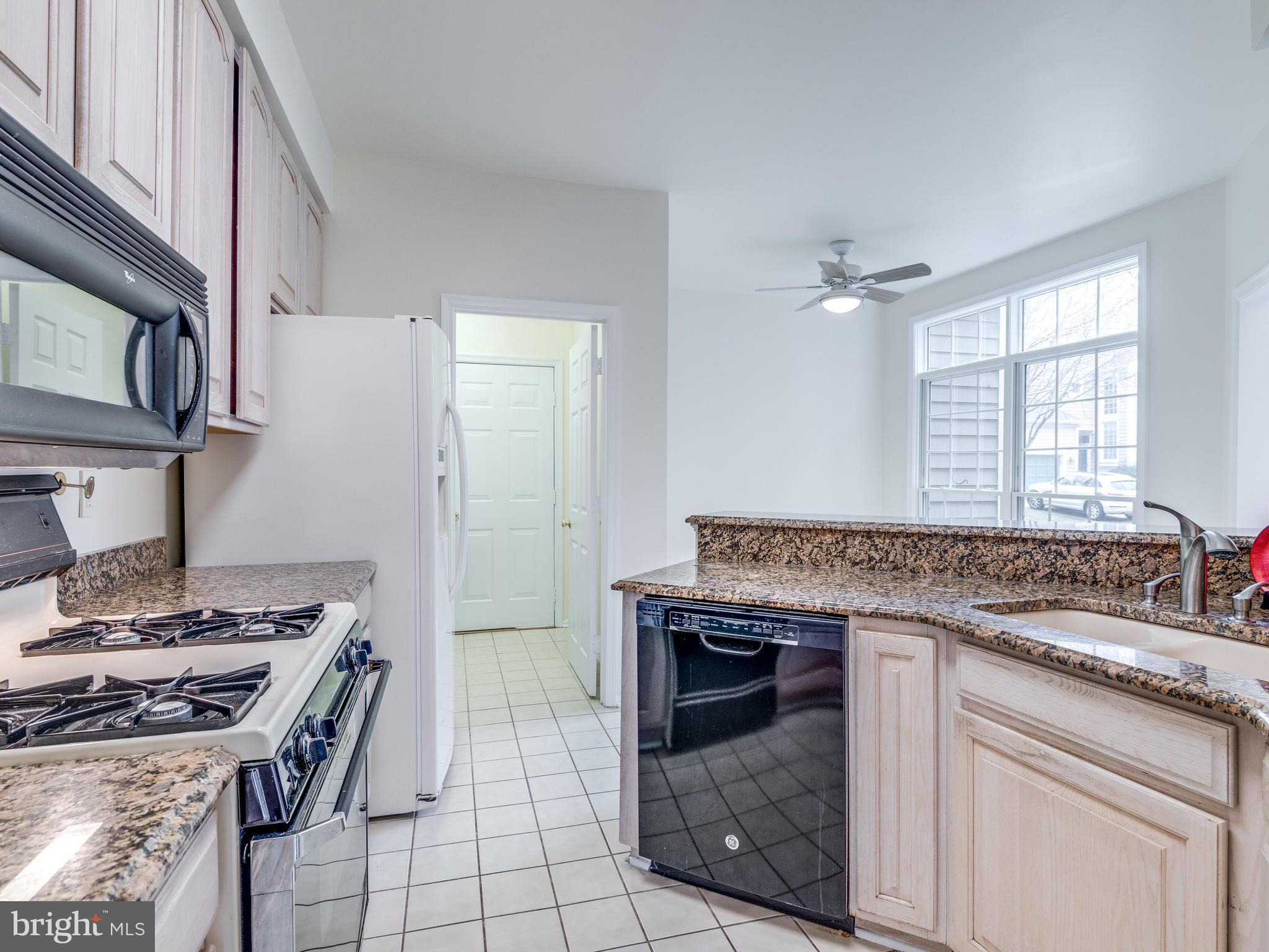11442 Hollow Timber Court Reston, VA 20194 - Photo 15 of 29 Kitchen with view to washer dryer and garage