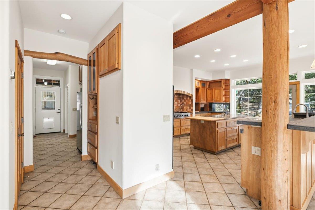 12531 Lowhills Road Nevada City, CA 95959 - Photo 23 of 92 a view of a kitchen with kitchen island granite countertop a refrigerator and a sink