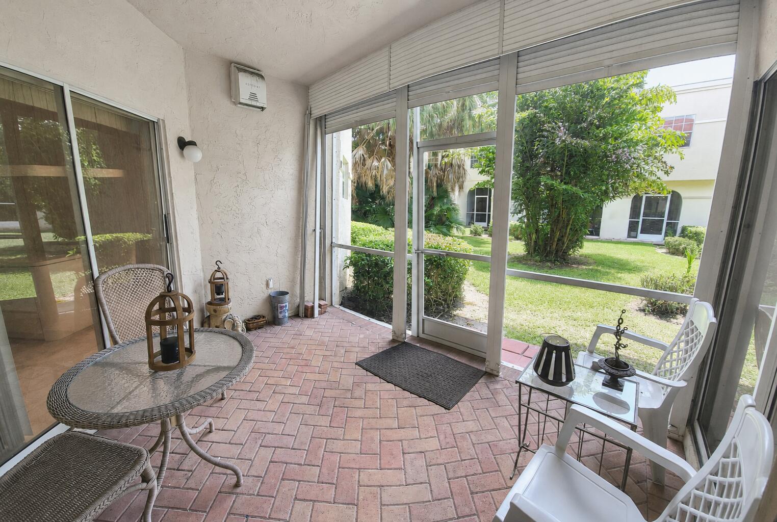 6566 Via Regina, Unit 6566 Boca Raton, FL 33433 - Photo 14 of 17 Garden view Covered screen patio