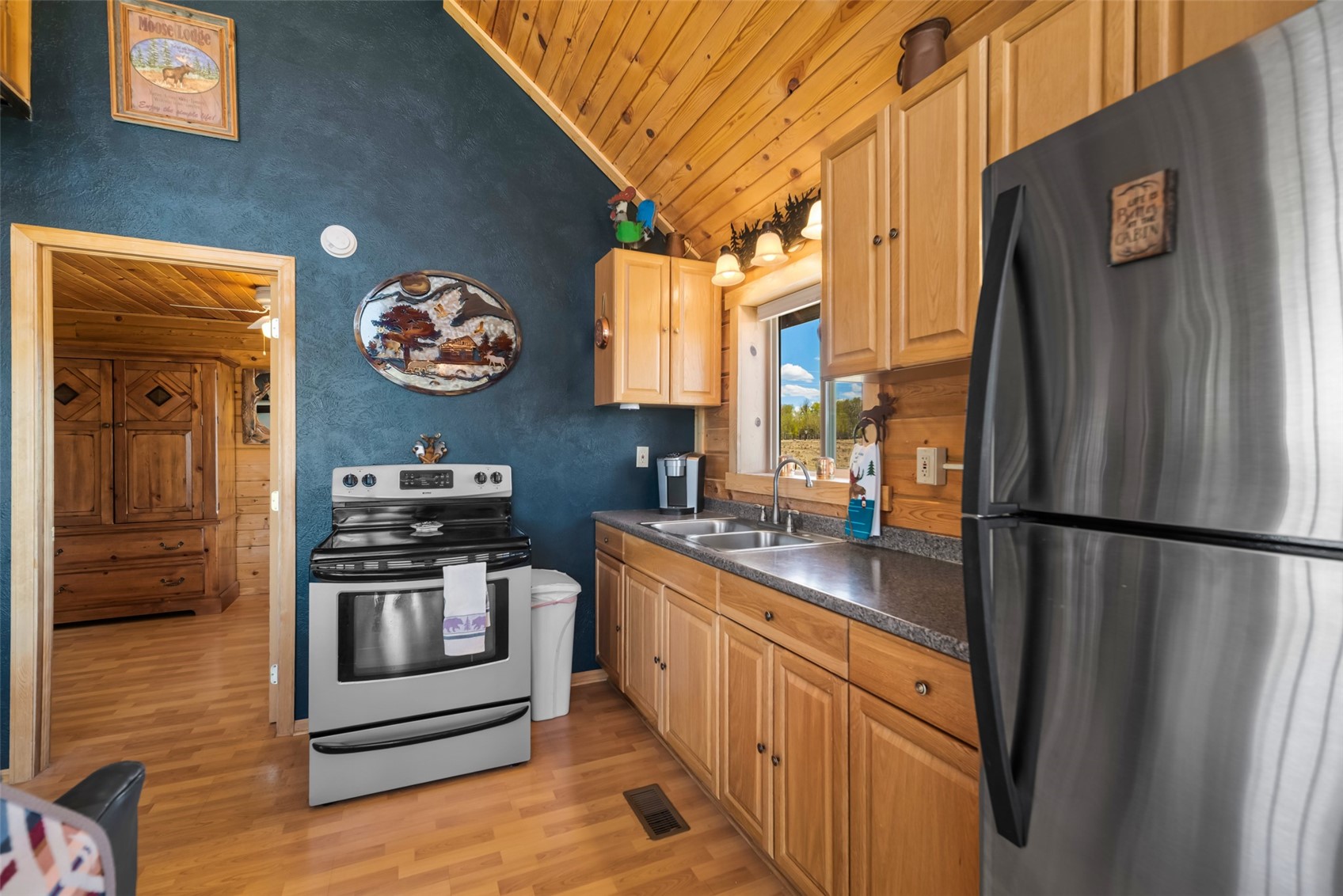 15 Mallard Road Como, CO 80432 - Photo 17 of 49 a kitchen with stainless steel appliances granite countertop a refrigerator a stove and a sink