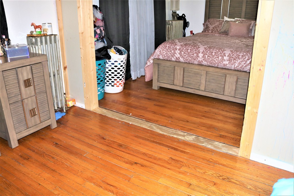 68-70 Appleton Street Springfield, MA 01108 - Photo 11 of 28 a bedroom with a bed and a cabinets