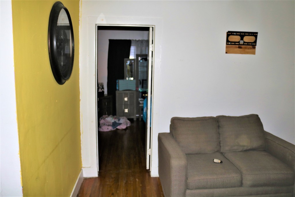 68-70 Appleton Street Springfield, MA 01108 - Photo 8 of 28 a view of a hallway with wooden floor and glass door