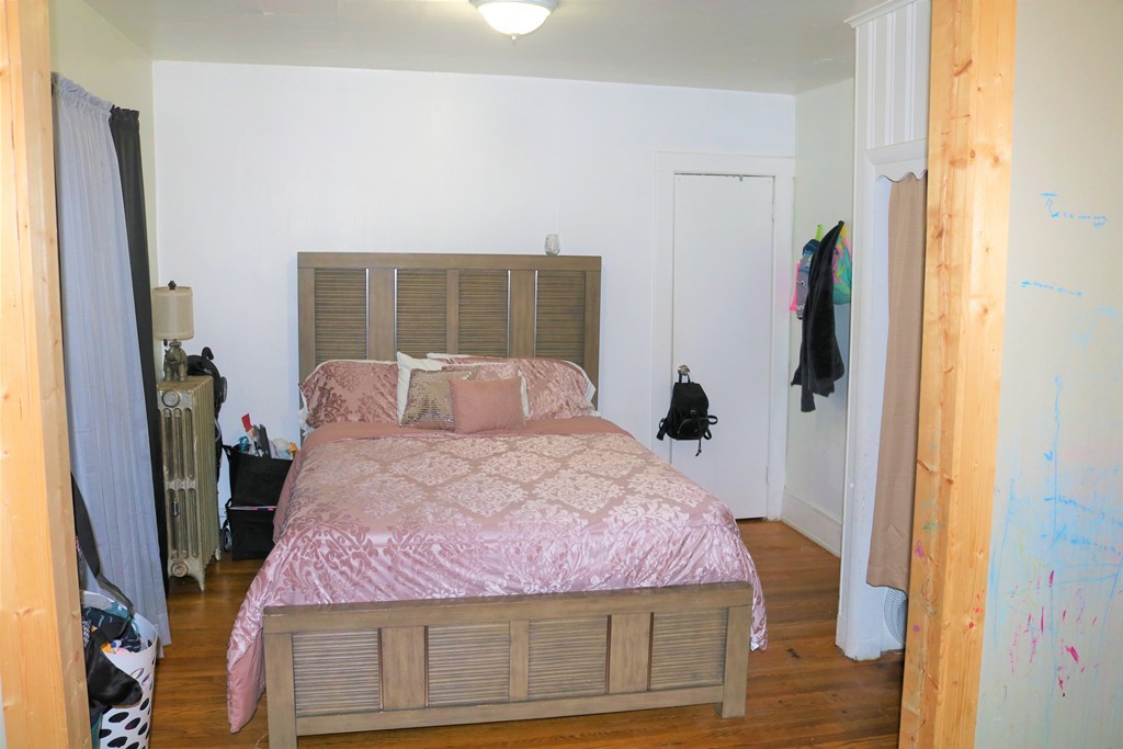 68-70 Appleton Street Springfield, MA 01108 - Photo 10 of 28 a bedroom with a bed and a mirror