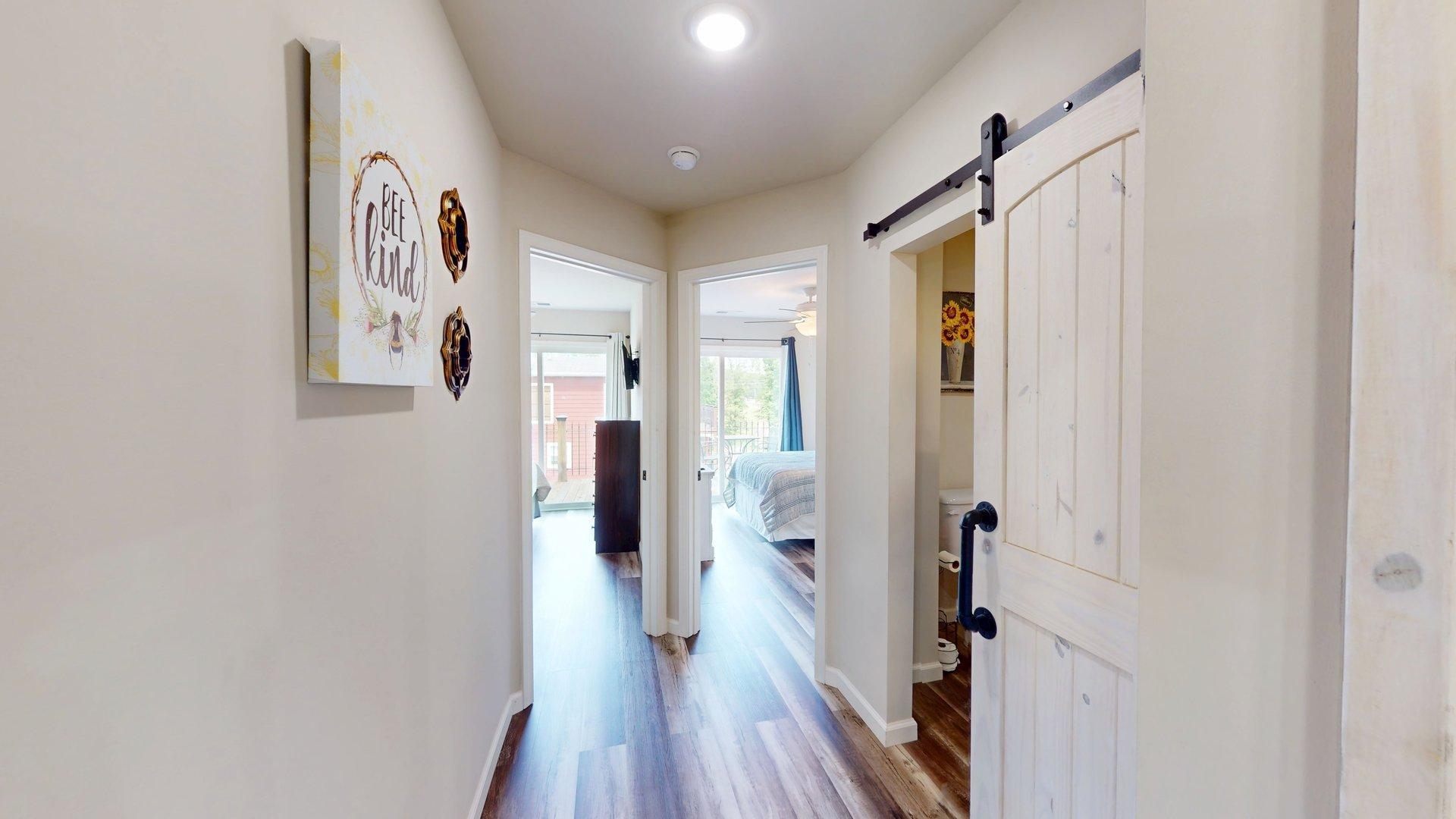 55 Bogey Loop Counce, TN 38326 - Photo 18 of 32 a view of a hallway with wooden floor and closet