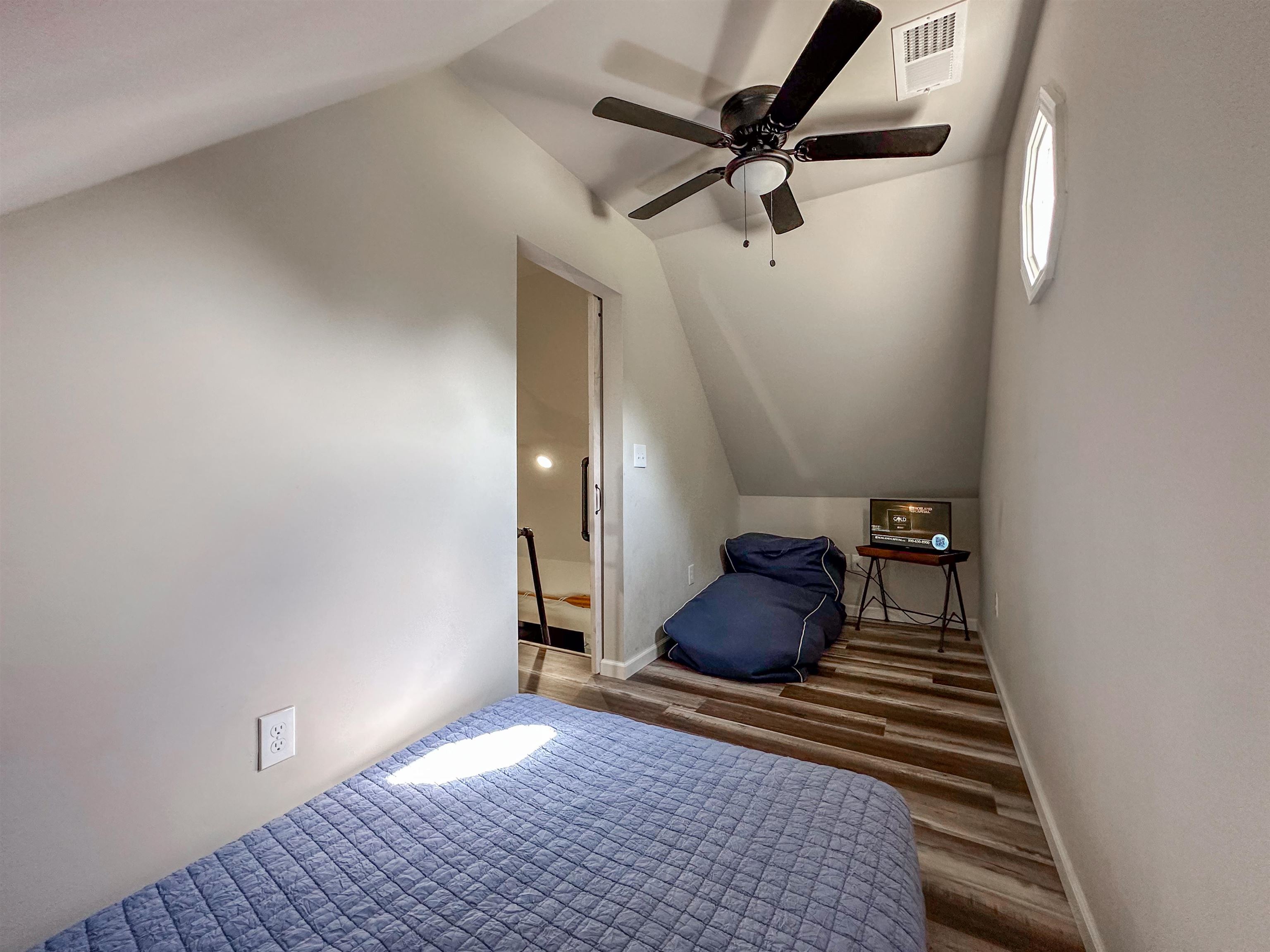 55 Bogey Loop Counce, TN 38326 - Photo 27 of 32 a bedroom with a bed and a rug