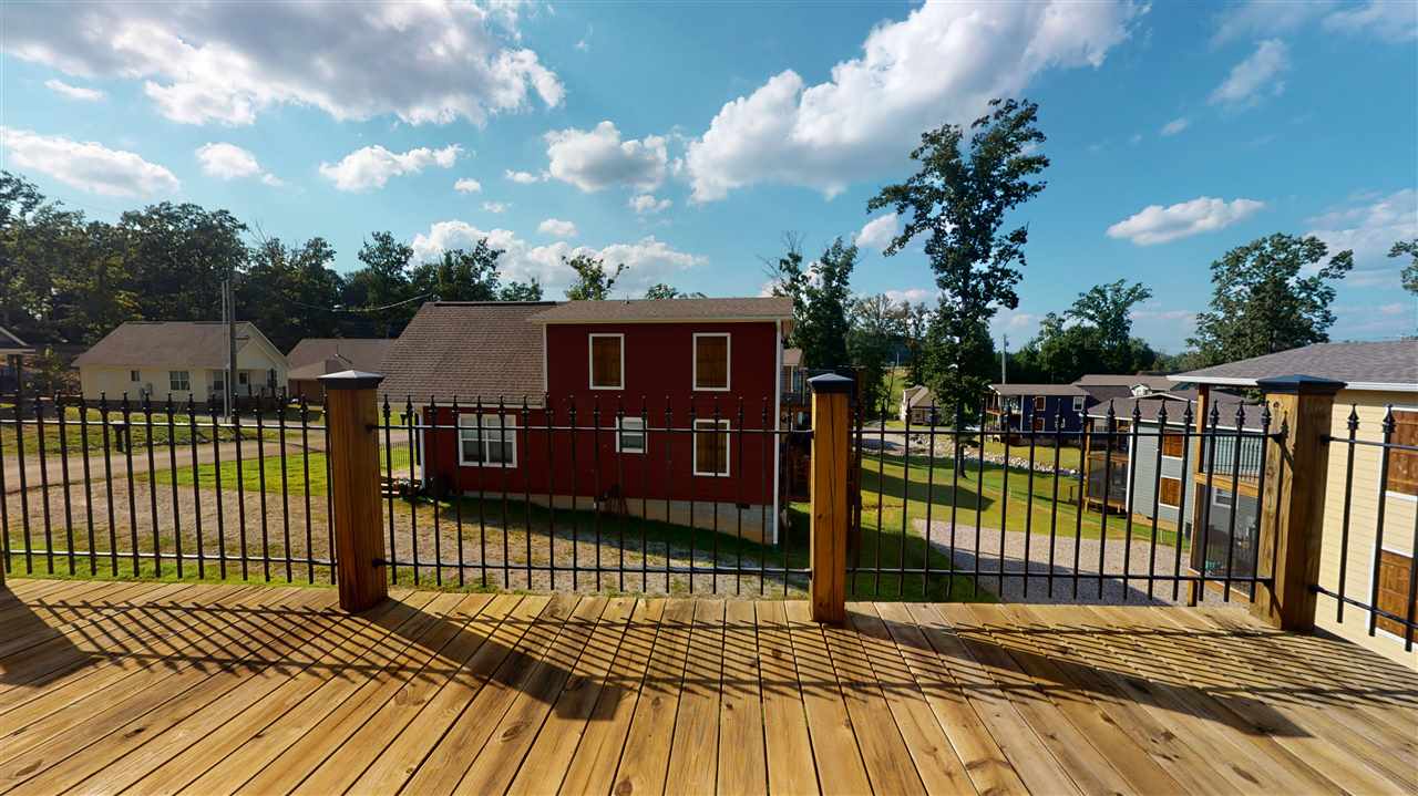55 Bogey Loop Counce, TN 38326 - Photo 30 of 32 a view of a balcony with wooden floor