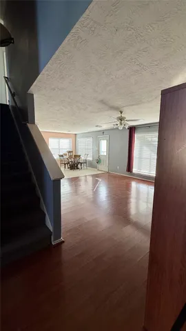 a view of entryway and kitchen