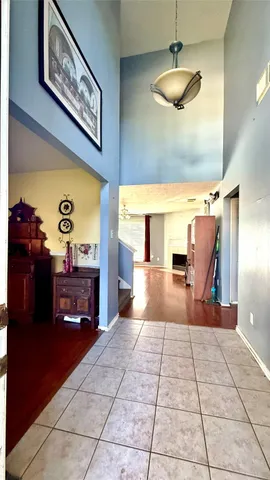 a view of living room with furniture and chandelier