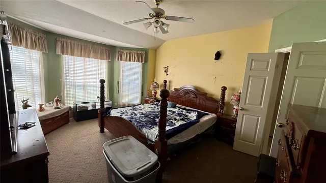 a bed room with furniture and a window