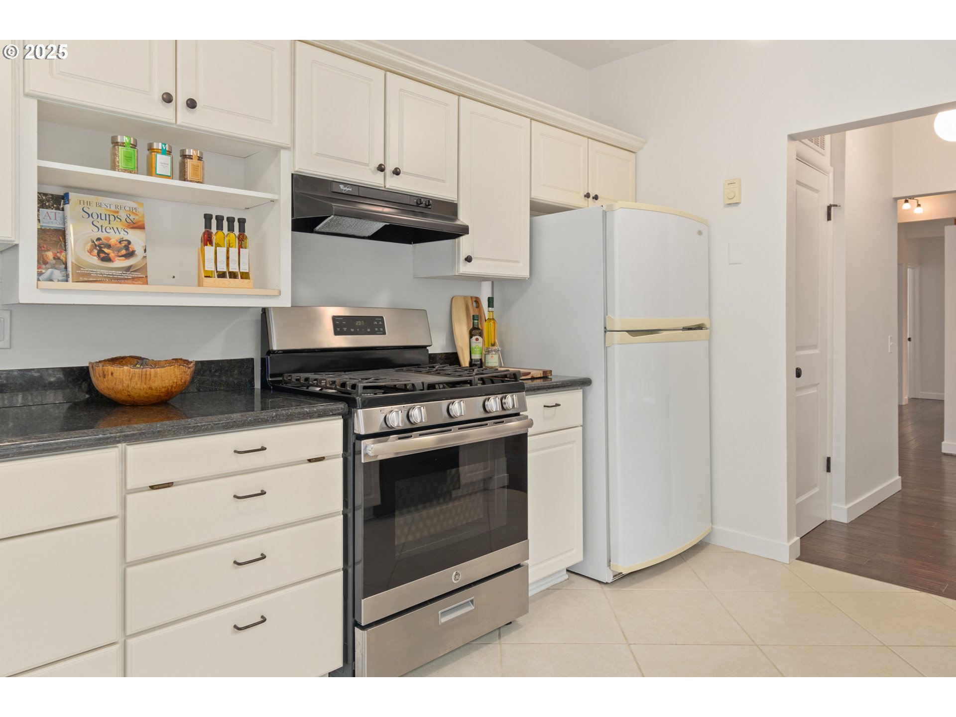 3820 Watkins Lane Eugene, OR 97405 - Photo 24 of 48 a kitchen with stainless steel appliances granite countertop a refrigerator and a stove