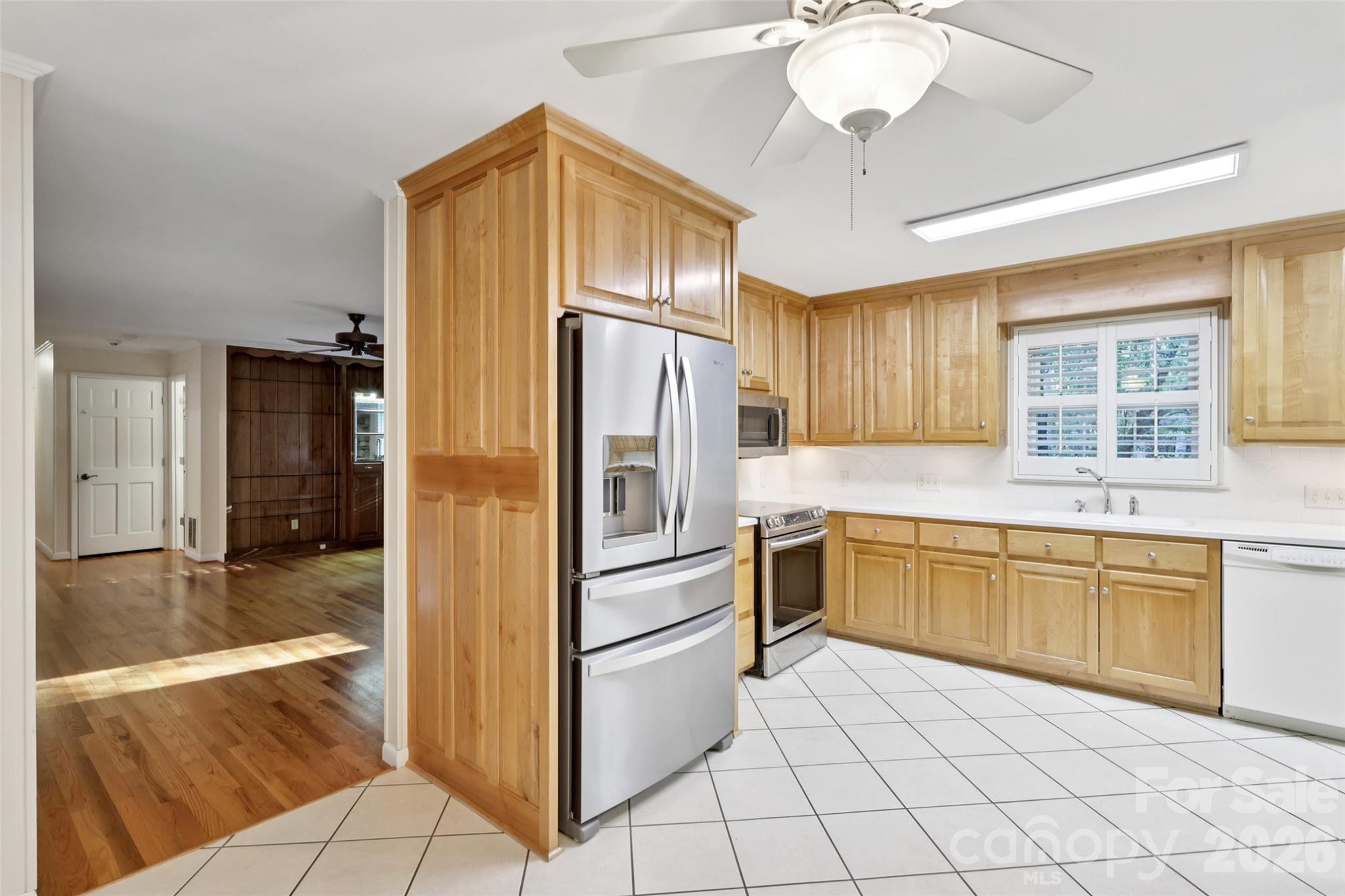 1002 Ridge Street Albemarle, NC 28001 - Photo 16 of 45 a kitchen with granite countertop a refrigerator and a sink