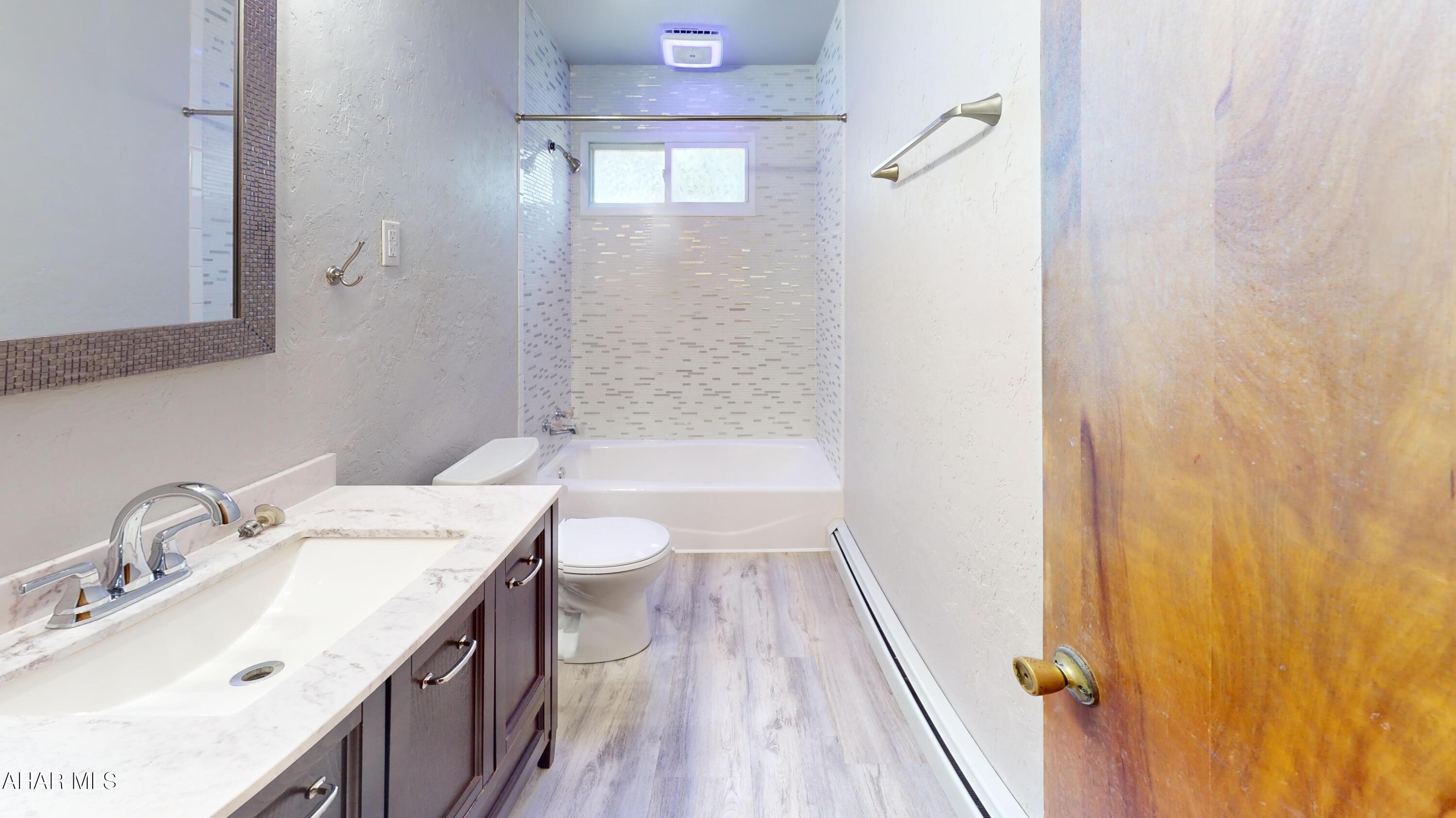 871 Decker Hollow Road Tyrone, PA 16686 - Photo 24 of 35 a bathroom with a sink a toilet and shower
