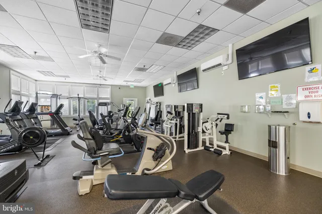 a view of a swimming pool with a patio and a garden