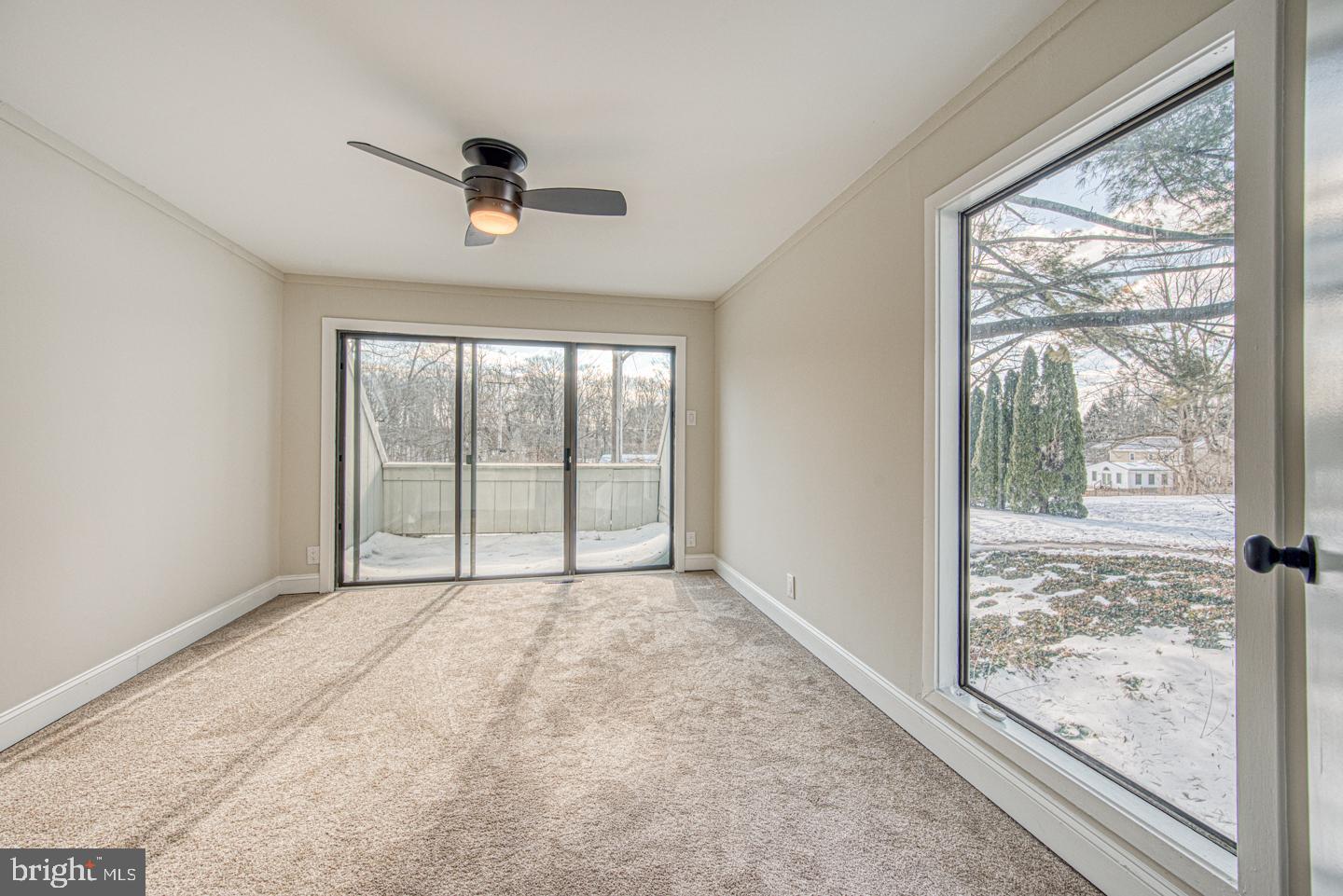 533 Summit House, Unit 533 West Chester, PA 19382 - Photo 13 of 18 a view of an empty room with wooden floor and a window