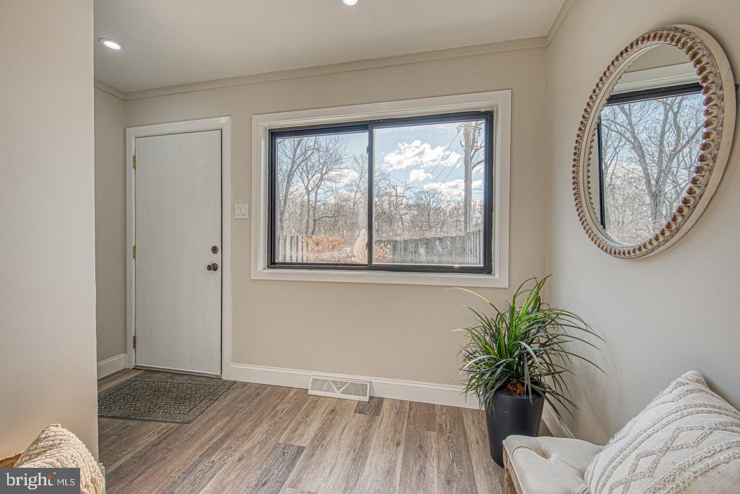 533 Summit House, Unit 533 West Chester, PA 19382 - Photo 3 of 18 a view of a bedroom with wooden floor and a window