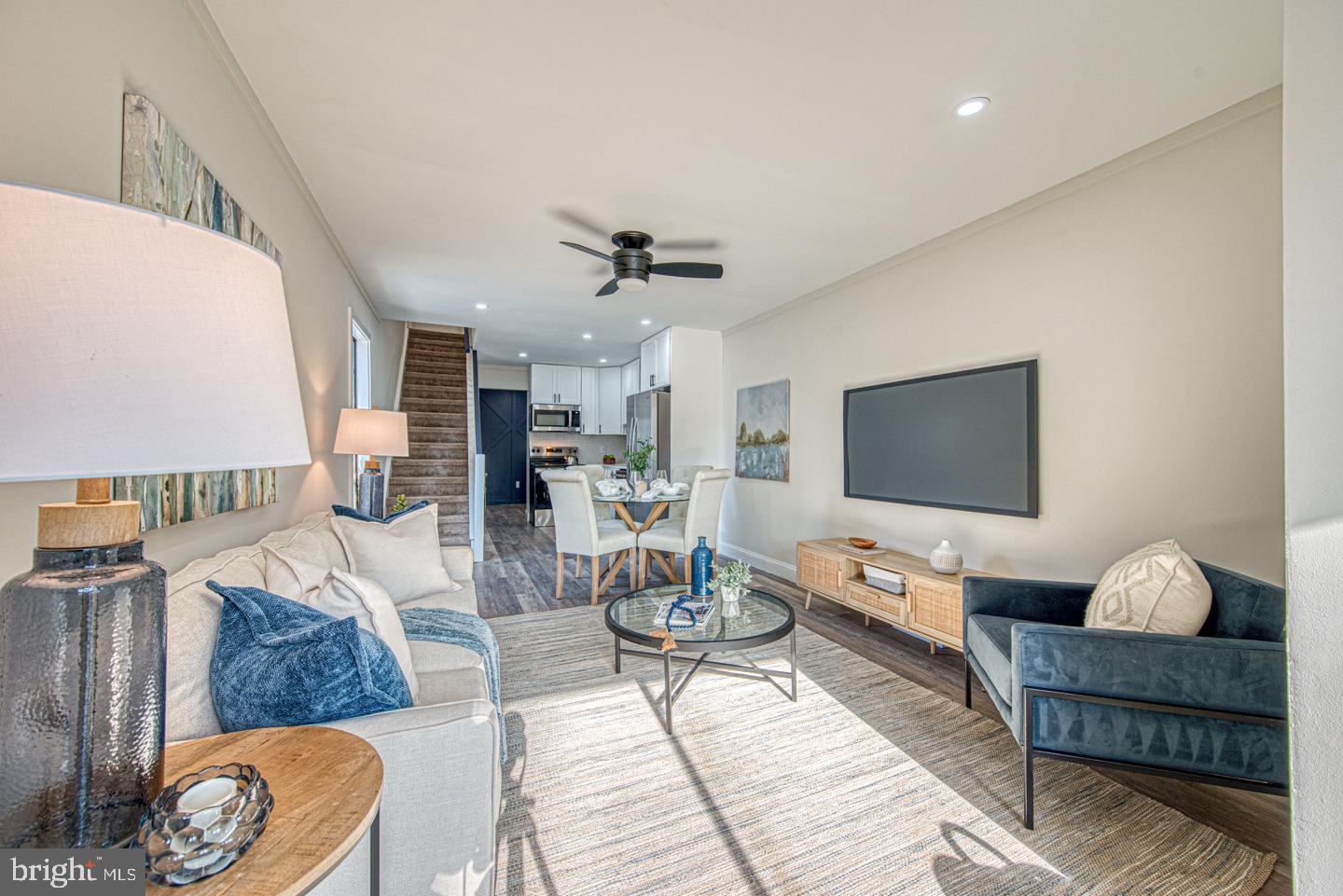 533 Summit House, Unit 533 West Chester, PA 19382 - Photo 5 of 18 a living room with furniture and a flat screen tv