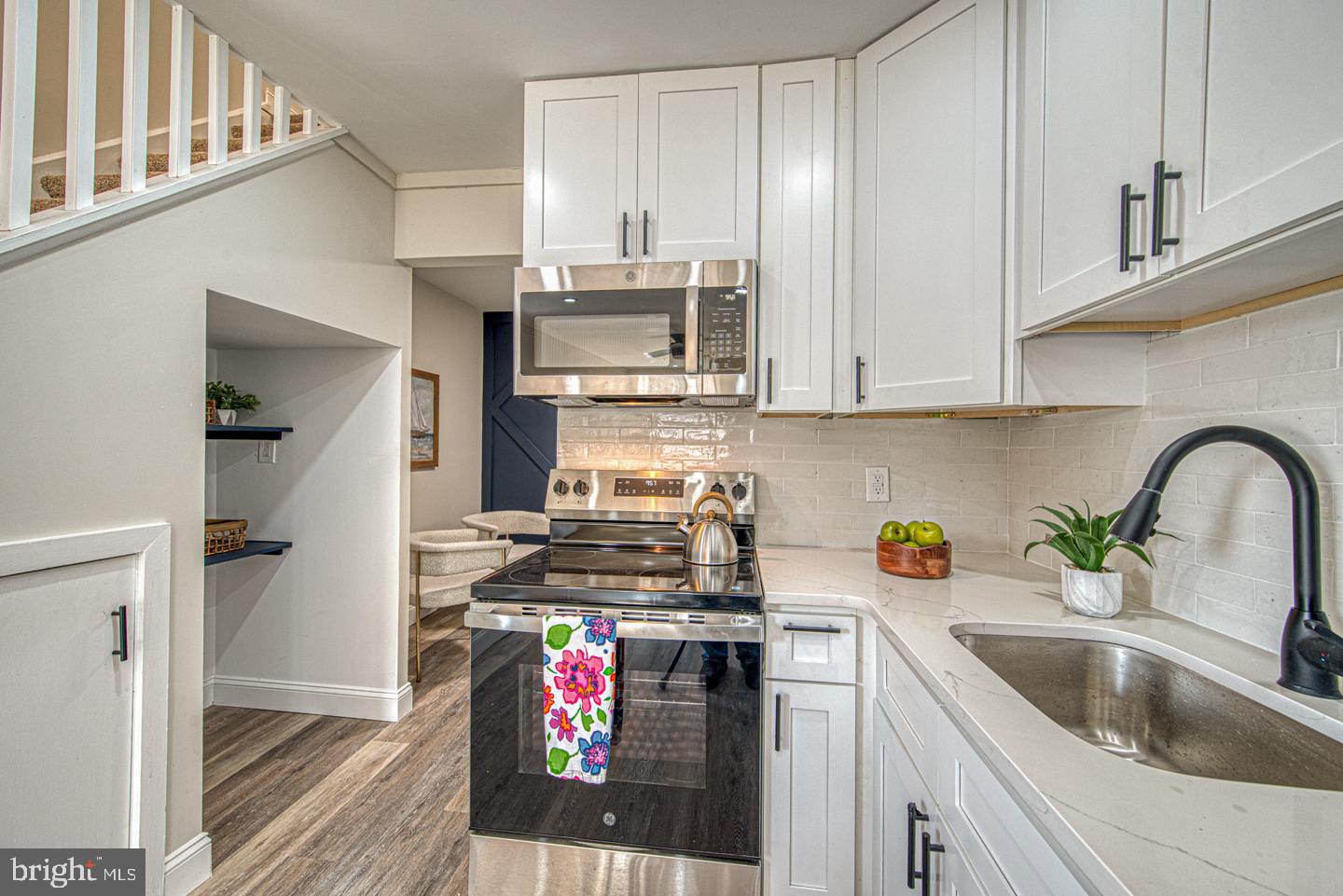 533 Summit House, Unit 533 West Chester, PA 19382 - Photo 8 of 18 a kitchen with stainless steel appliances granite countertop a sink stove and cabinets