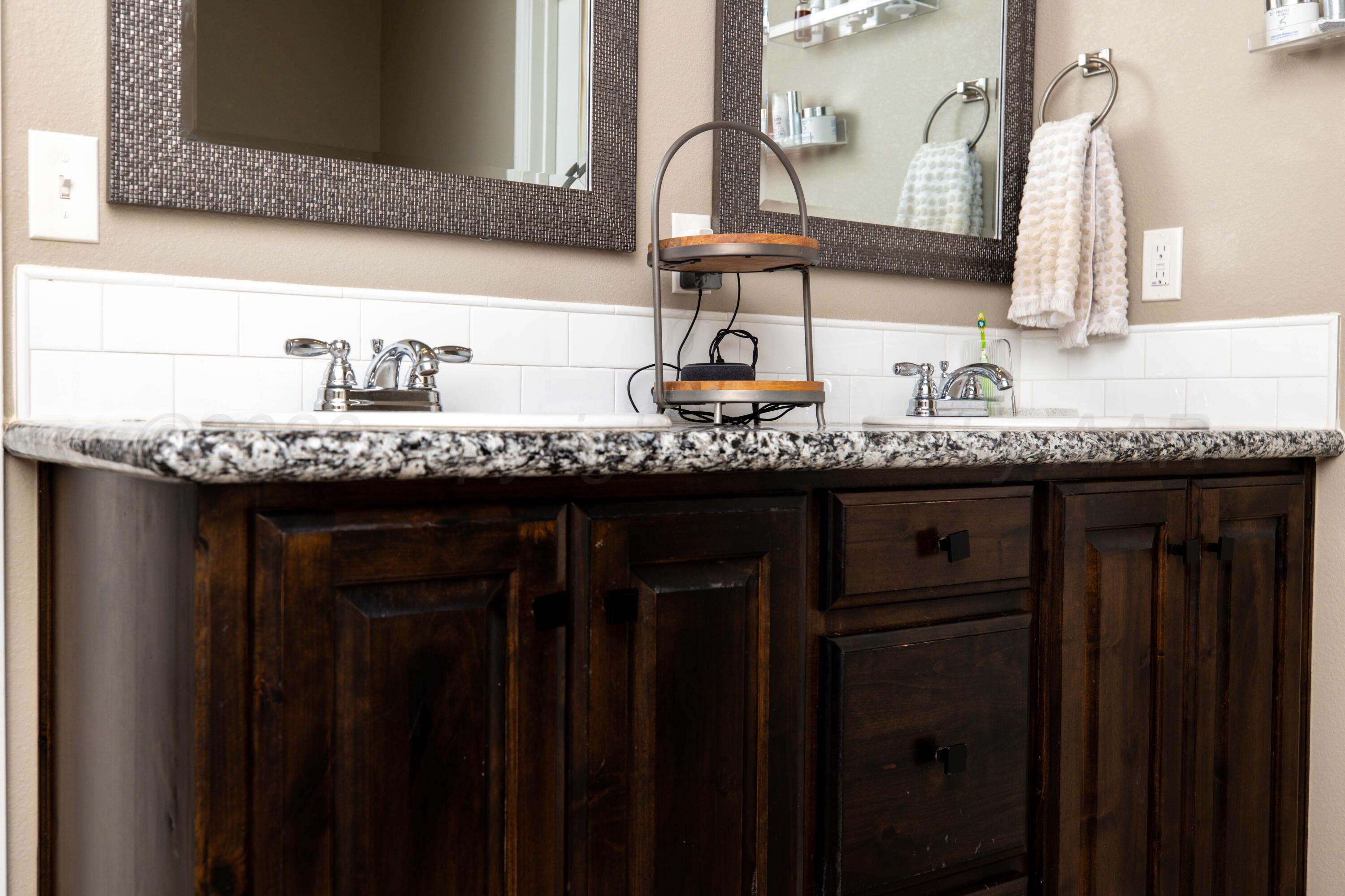 9834 Remington Road Canyon, TX 79015 - Photo 21 of 46 a bathroom with sinks and mirror
