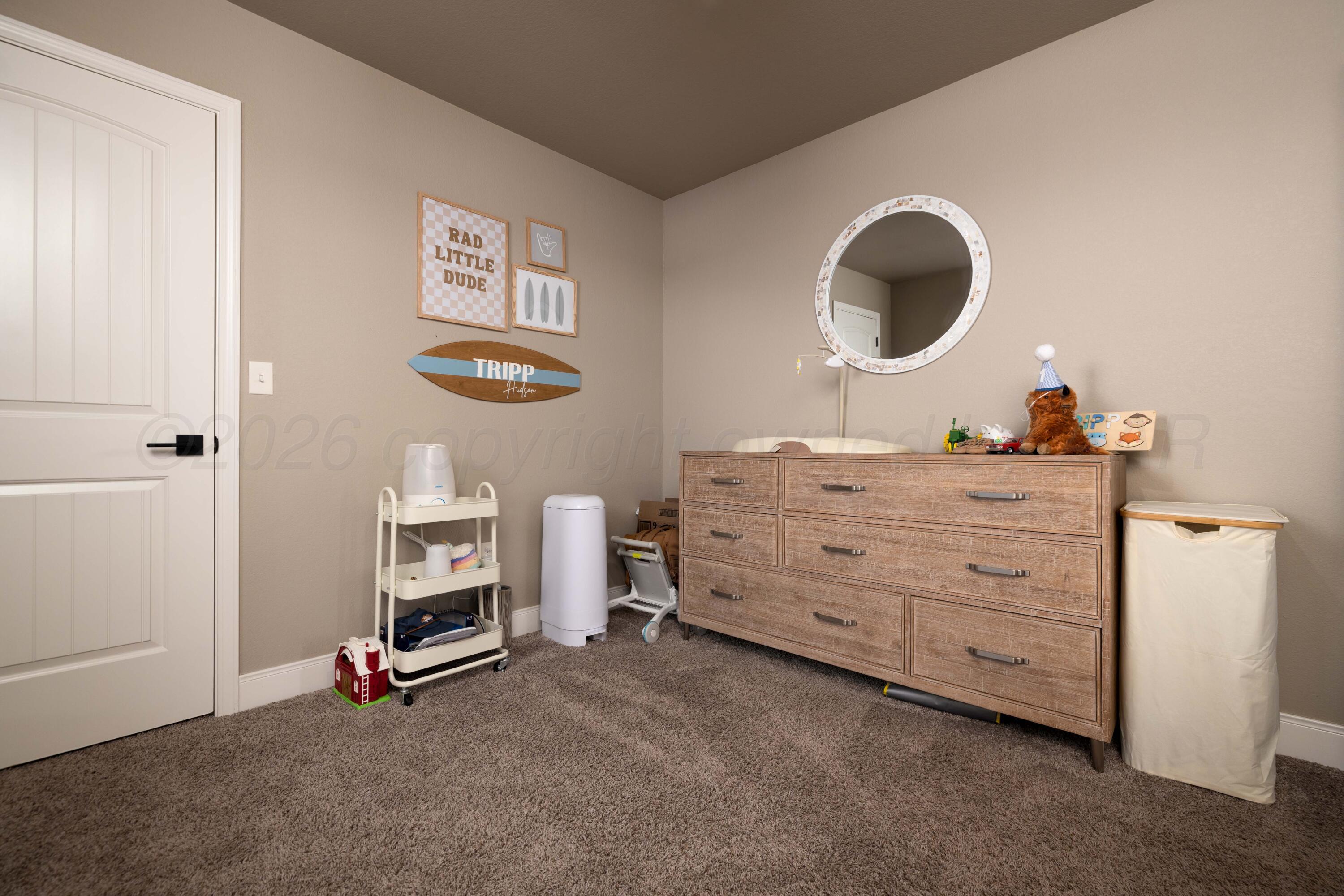 9834 Remington Road Canyon, TX 79015 - Photo 22 of 46 a room with furniture and a mirror