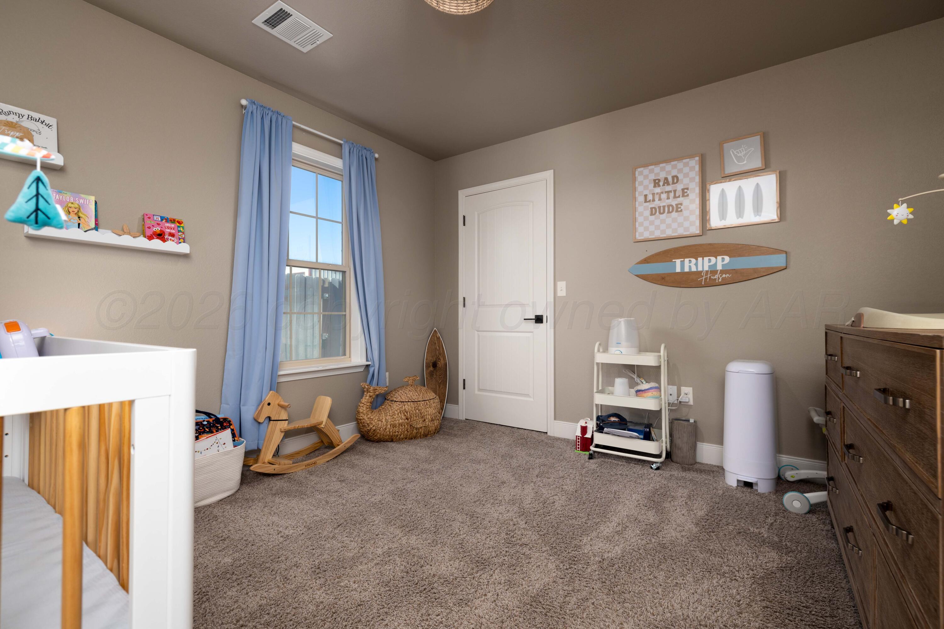 9834 Remington Road Canyon, TX 79015 - Photo 27 of 46 a view of a room with baby crib and a window