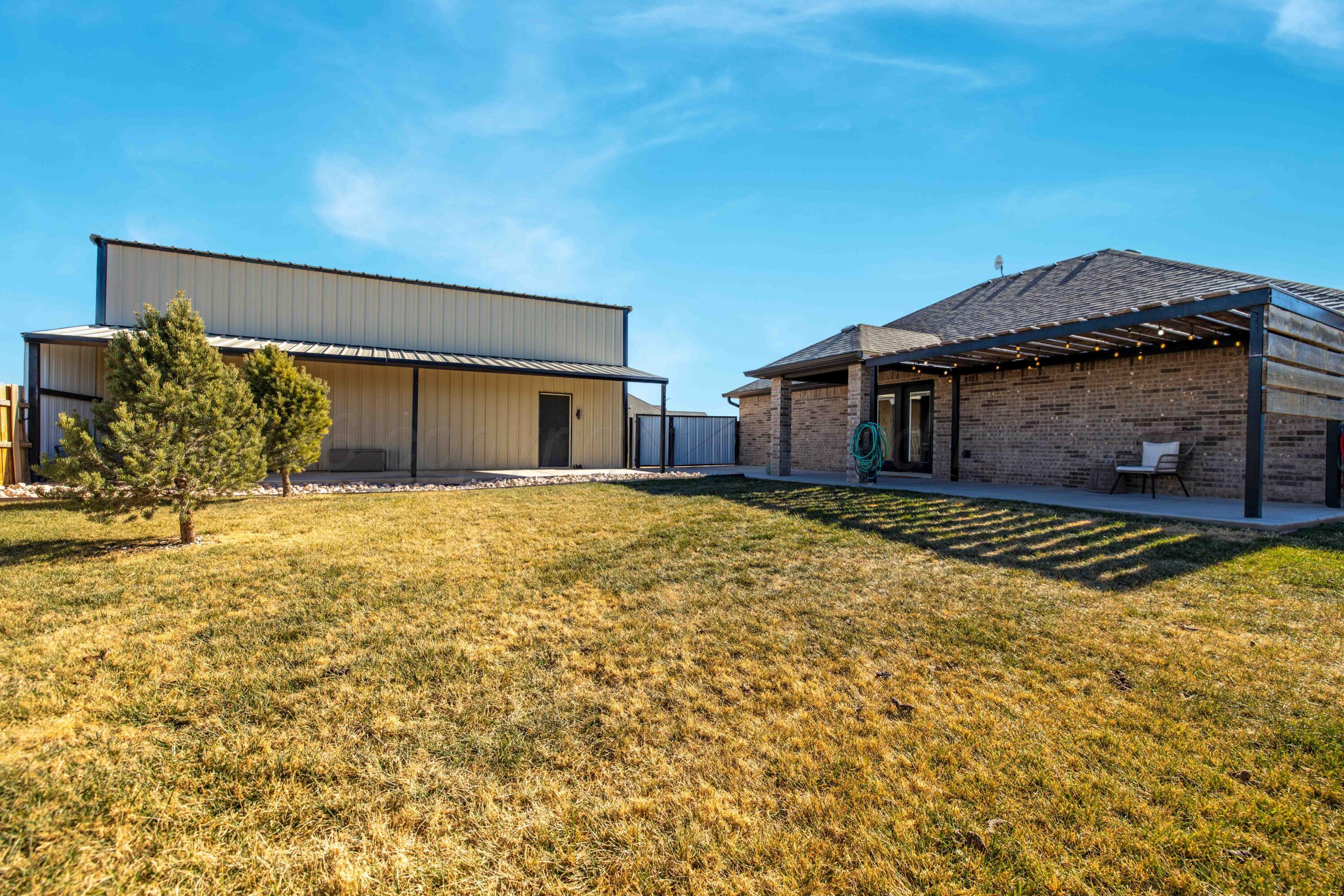 9834 Remington Road Canyon, TX 79015 - Photo 30 of 46 a front view of a house with a yard