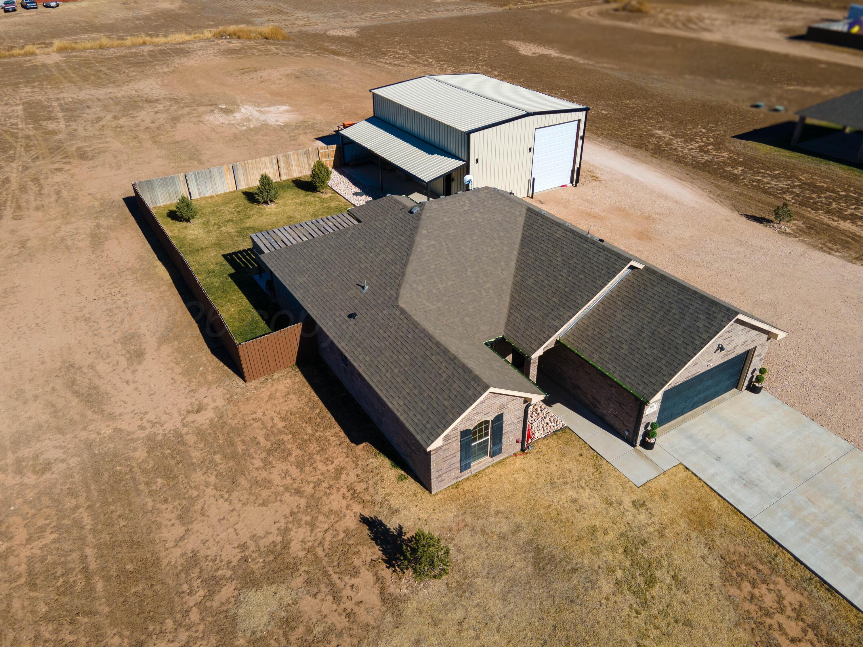 9834 Remington Road Canyon, TX 79015 - Photo 46 of 46 an aerial view of a house with roof deck