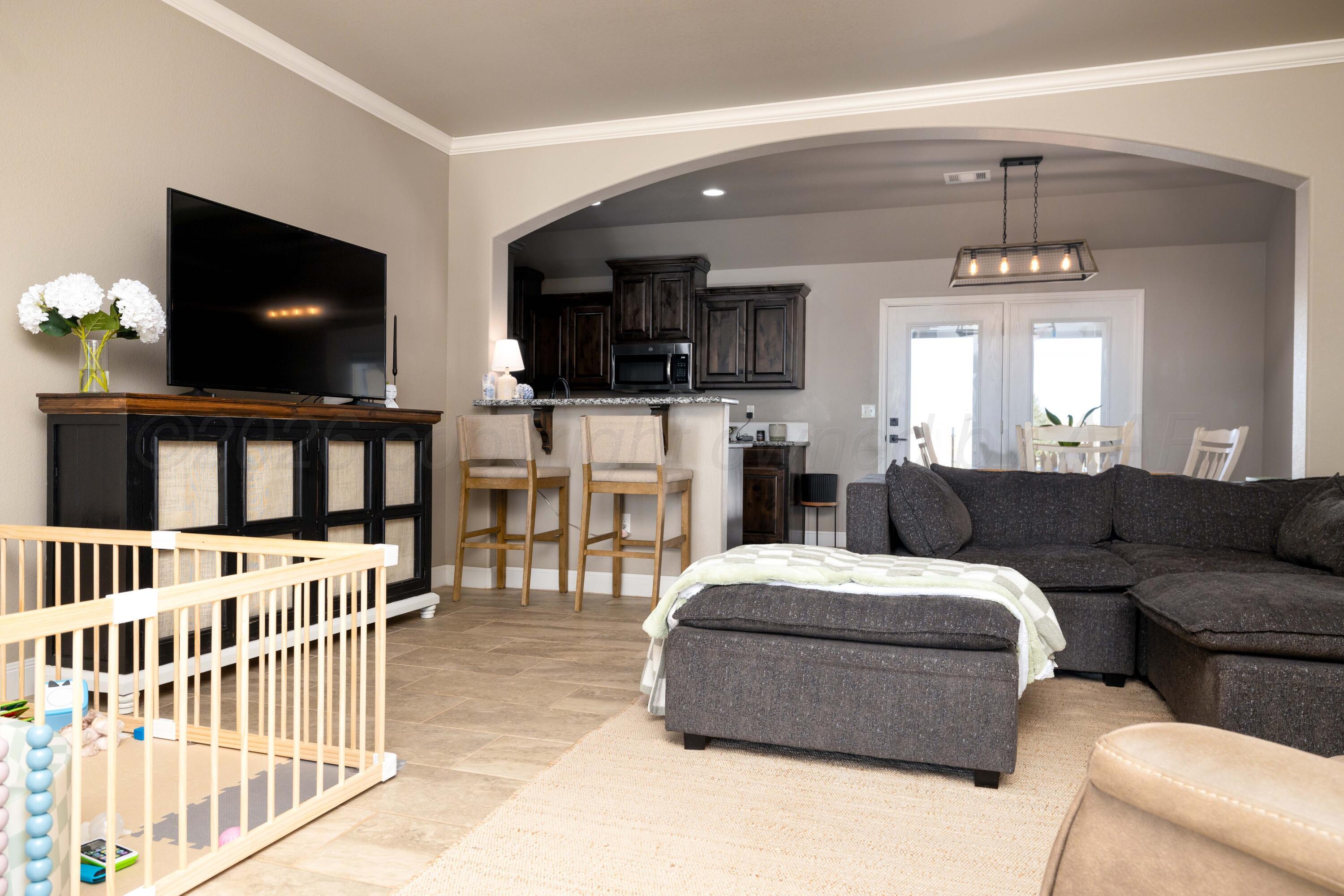 9834 Remington Road Canyon, TX 79015 - Photo 5 of 46 a living room with furniture and a flat screen tv