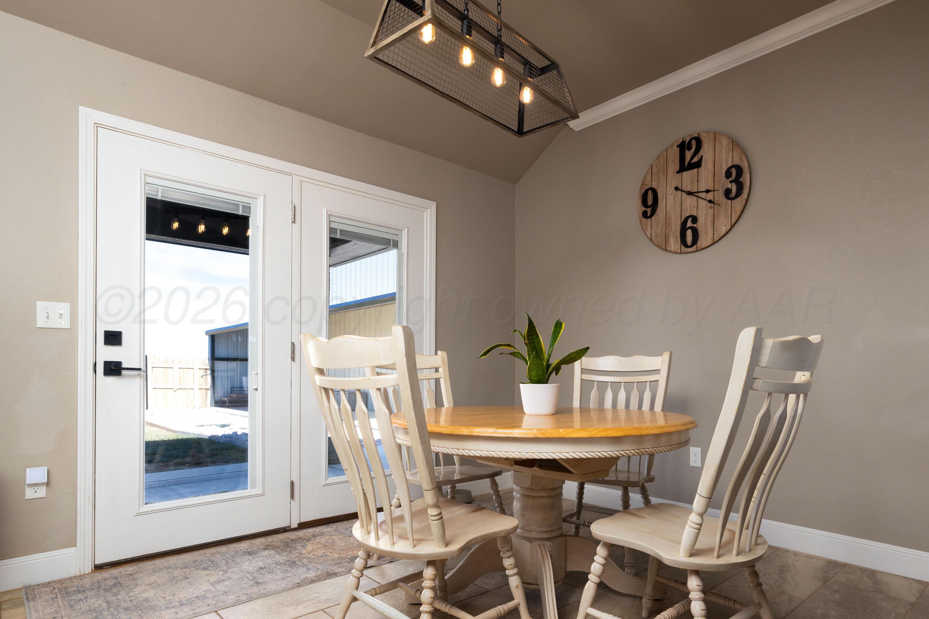 9834 Remington Road Canyon, TX 79015 - Photo 10 of 46 a view of a dining room with furniture and chandelier