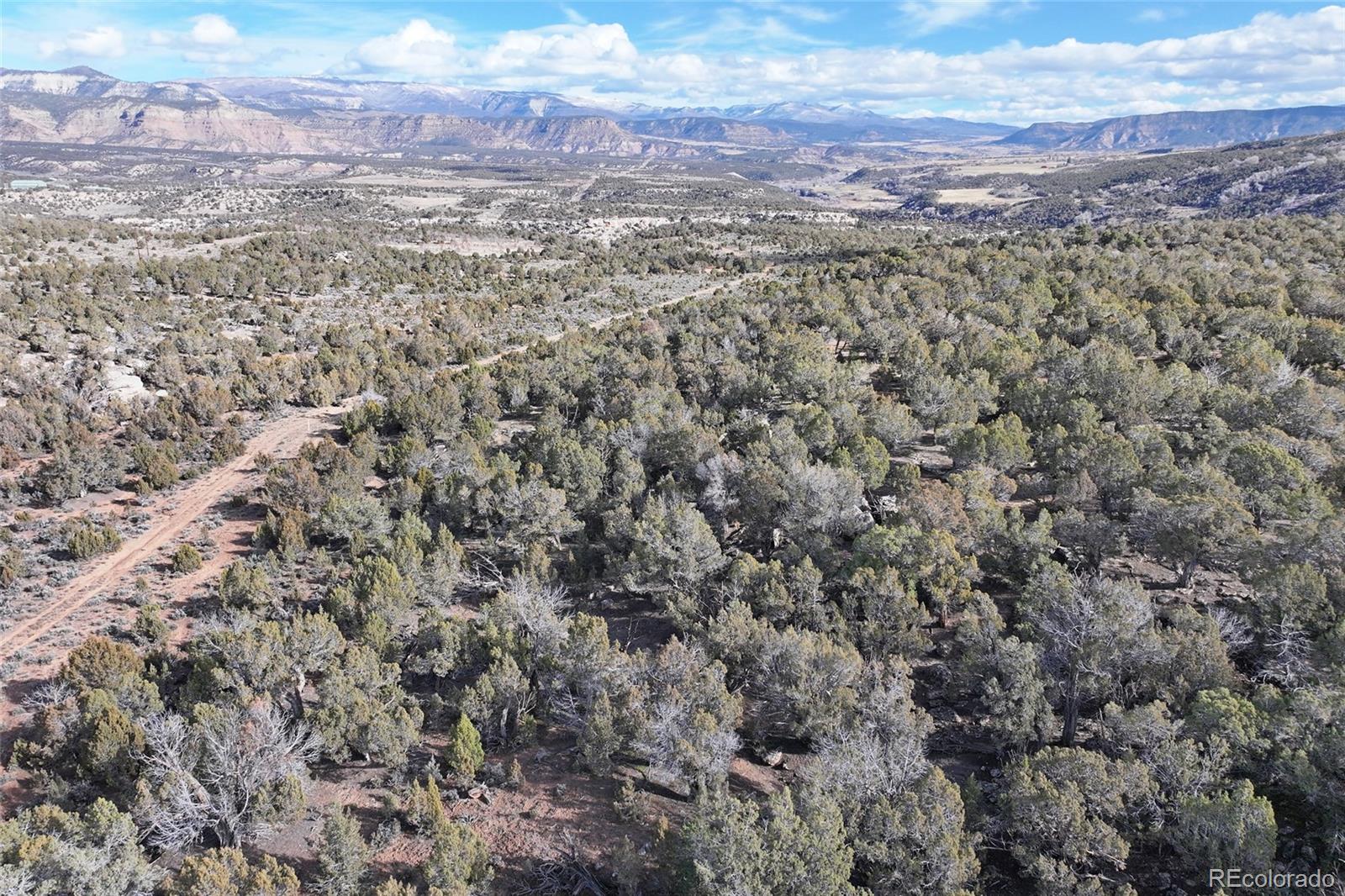 0 To Be Determined De Beque, CO 81630 - Photo 17 of 20 a view of a city with mountains in the background