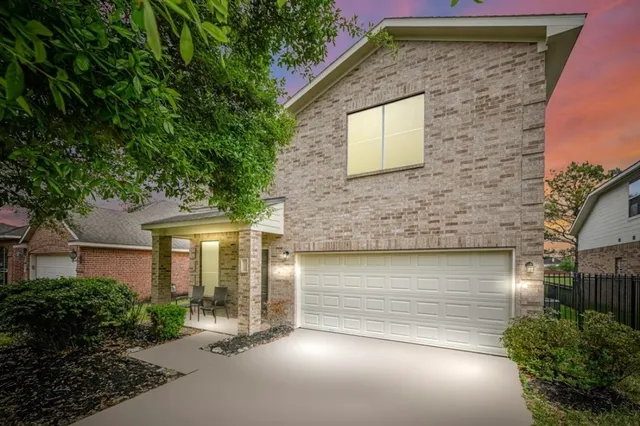 a front view of a house with garage
