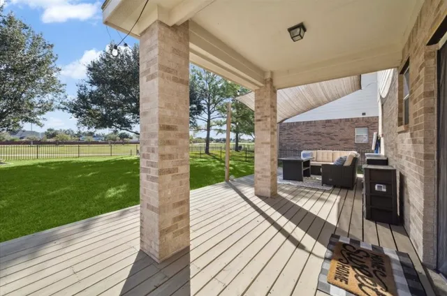 a view of a patio with wooden floor