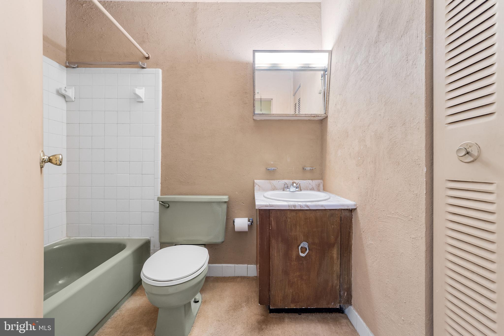 803 Timber Creek Road Clementon, NJ 08021 - Photo 18 of 26 a bathroom with a sink a toilet and bathtub