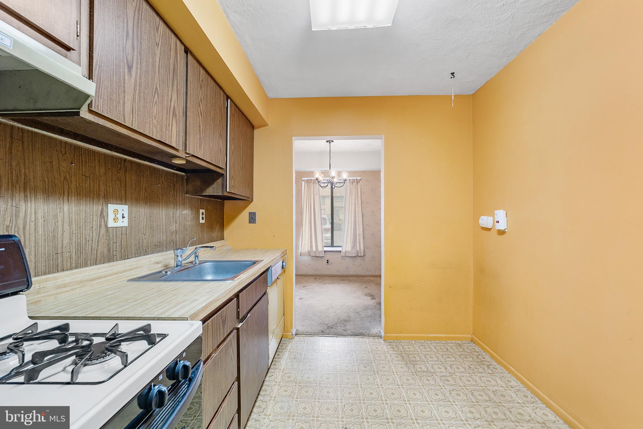 803 Timber Creek Road Clementon, NJ 08021 - Photo 8 of 26 a kitchen with a sink stove and cabinets