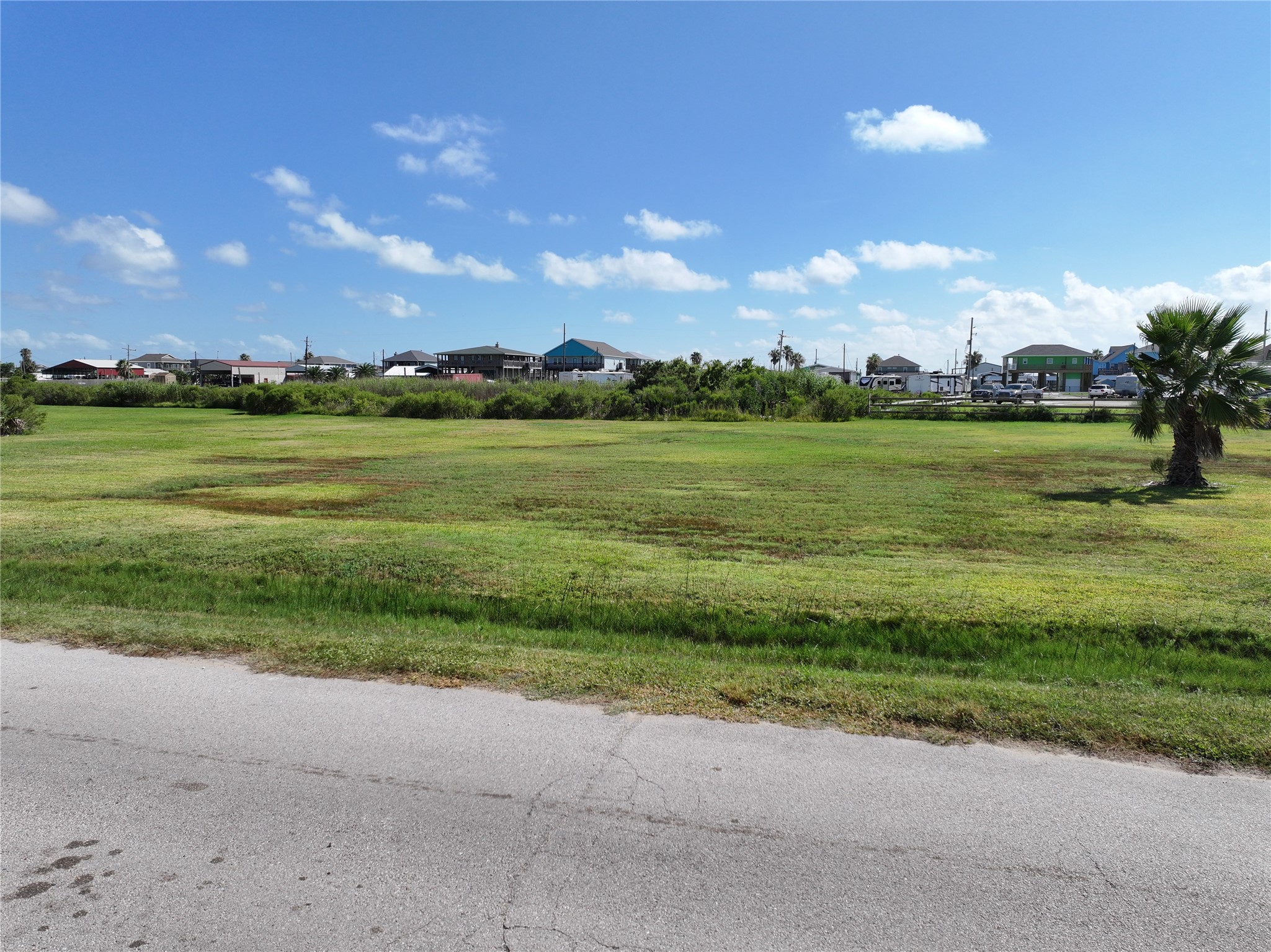 Lot 28-35 Diamond Road Crystal Beach, TX 77650 - Photo 13 of 15 a view of a lake with houses in the background