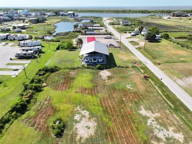 an aerial view of a residential houses with outdoor space