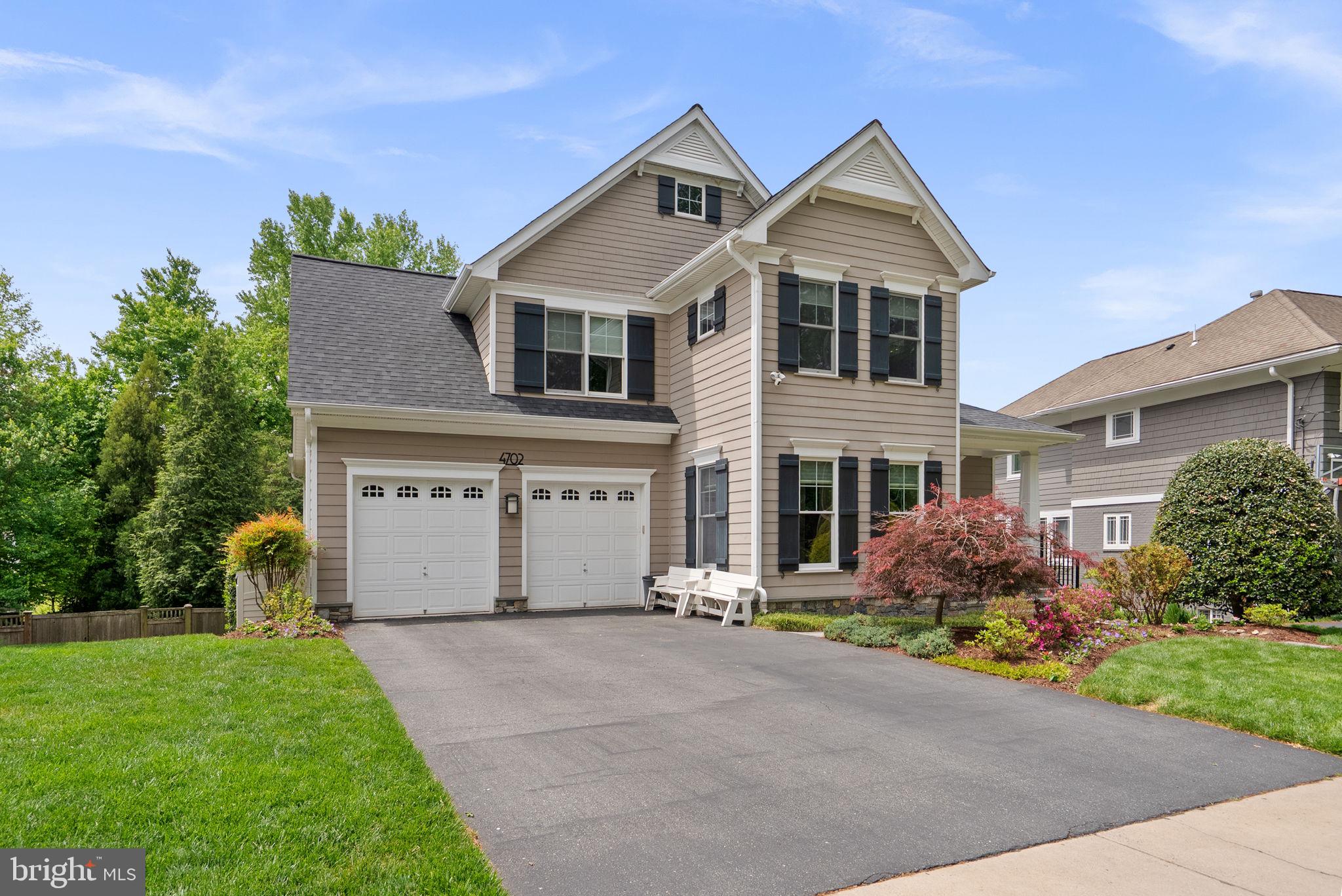 Charming home with lush landscaping.