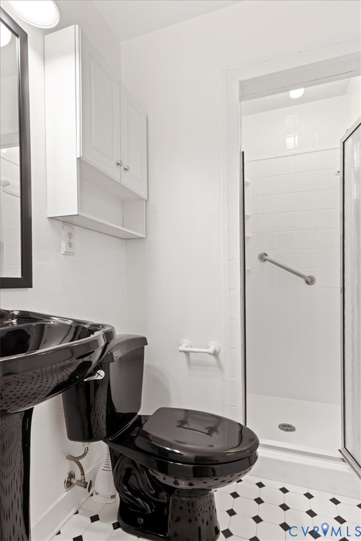 2502 Landon Road Richmond, VA 23294 - Photo 15 of 26 a bathroom with a sink a toilet and shower