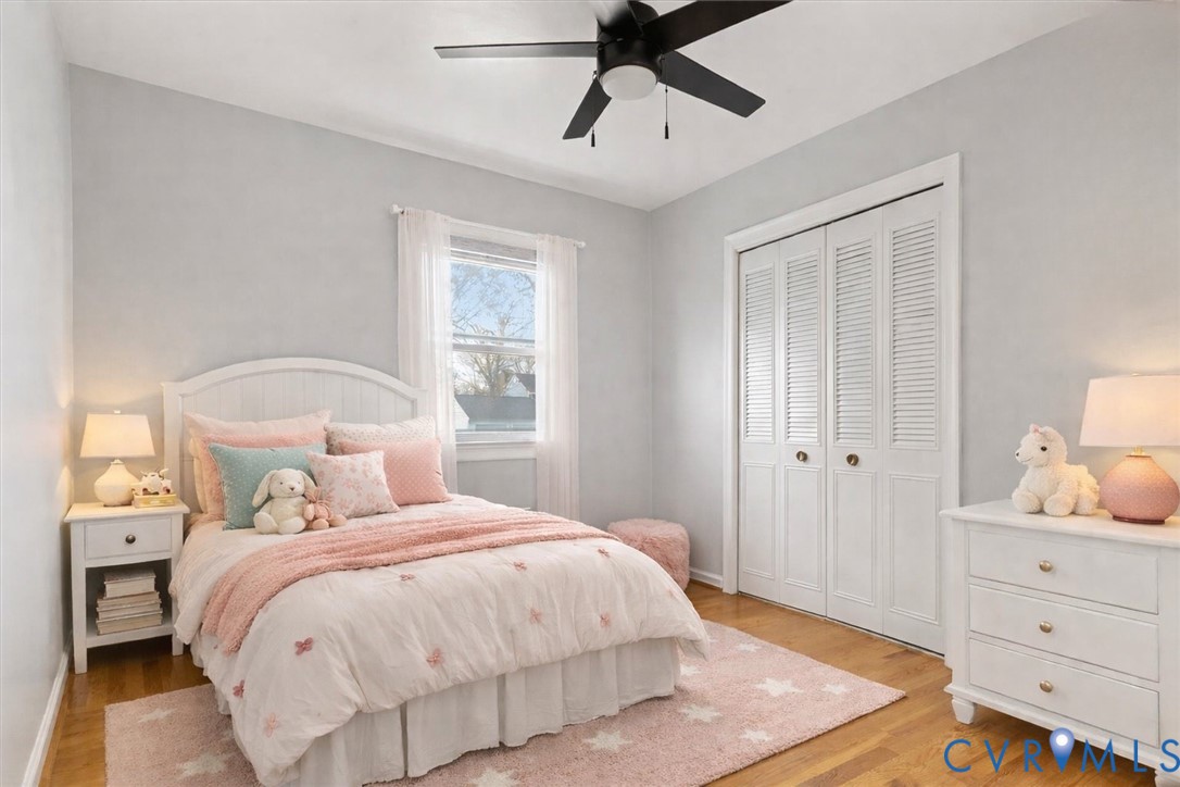 2502 Landon Road Richmond, VA 23294 - Photo 16 of 26 a bedroom with a bed and wooden floor